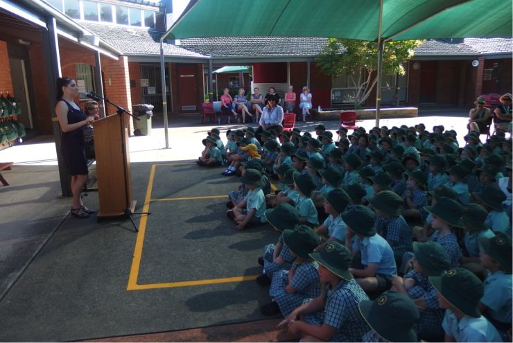 Nas speaking in front of the whole school.