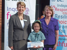Abbey Flanagan receives her award from Principal Sue Veling and Director of System Performance (Penrith-Mountains) Christine Howe