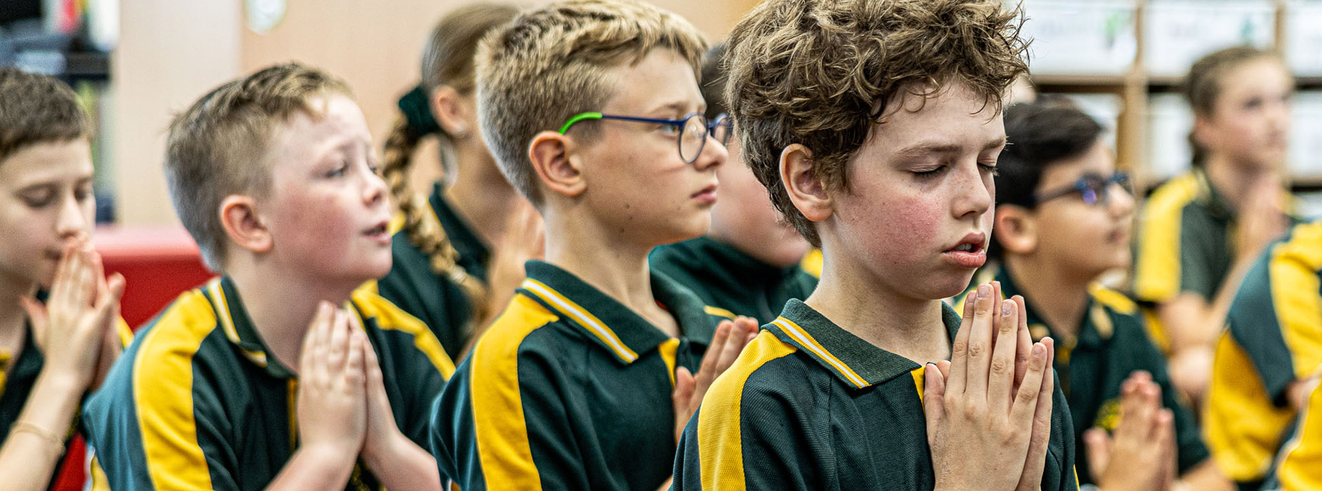 Students praying at Our Lady of the Way Catholic Primary Emu Plains