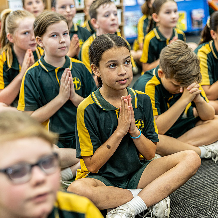 Students praying at Our Lady of the Way Catholic Primary Emu Plains