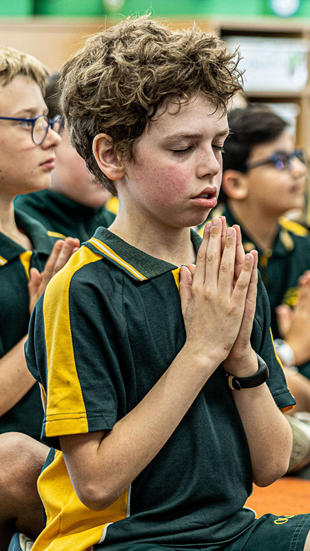 Students praying at Our Lady of the Way Catholic Primary Emu Plains