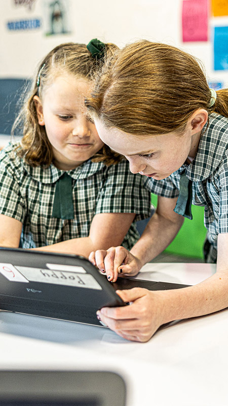 Our Lady of the Way Catholic Primary Emu Plains girls collaborating in class