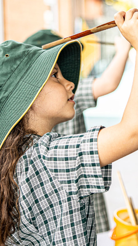 Students paining outdoors at Our Lady of the Way Catholic Primary Emu Plains