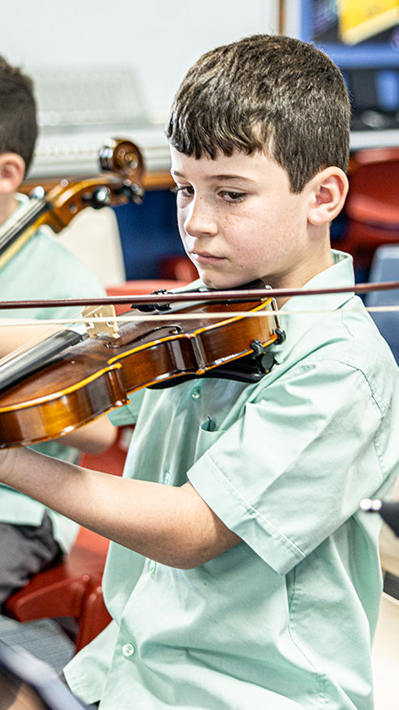 Students playing violin at Our Lady of the Way Catholic Primary Emu Plains