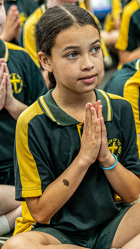 Students praying at Our Lady of the Way Catholic Primary Emu Plains