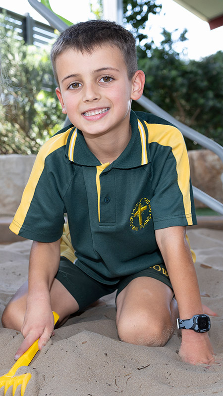 Our Lady of the Way Catholic Primary Emu Plains student playing in sandpit