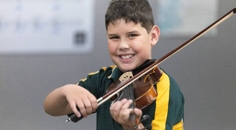 Our Lady of the Way Primary Emu Plains student playing musical instrument